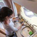 Woman cooking in camper