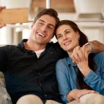 Couple sitting together on RV Loveseat Sleepers
